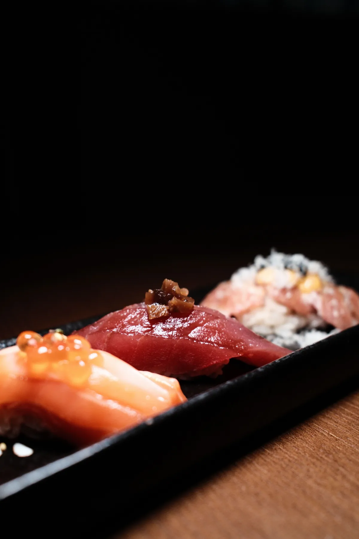 Nigiri arranged on a black board