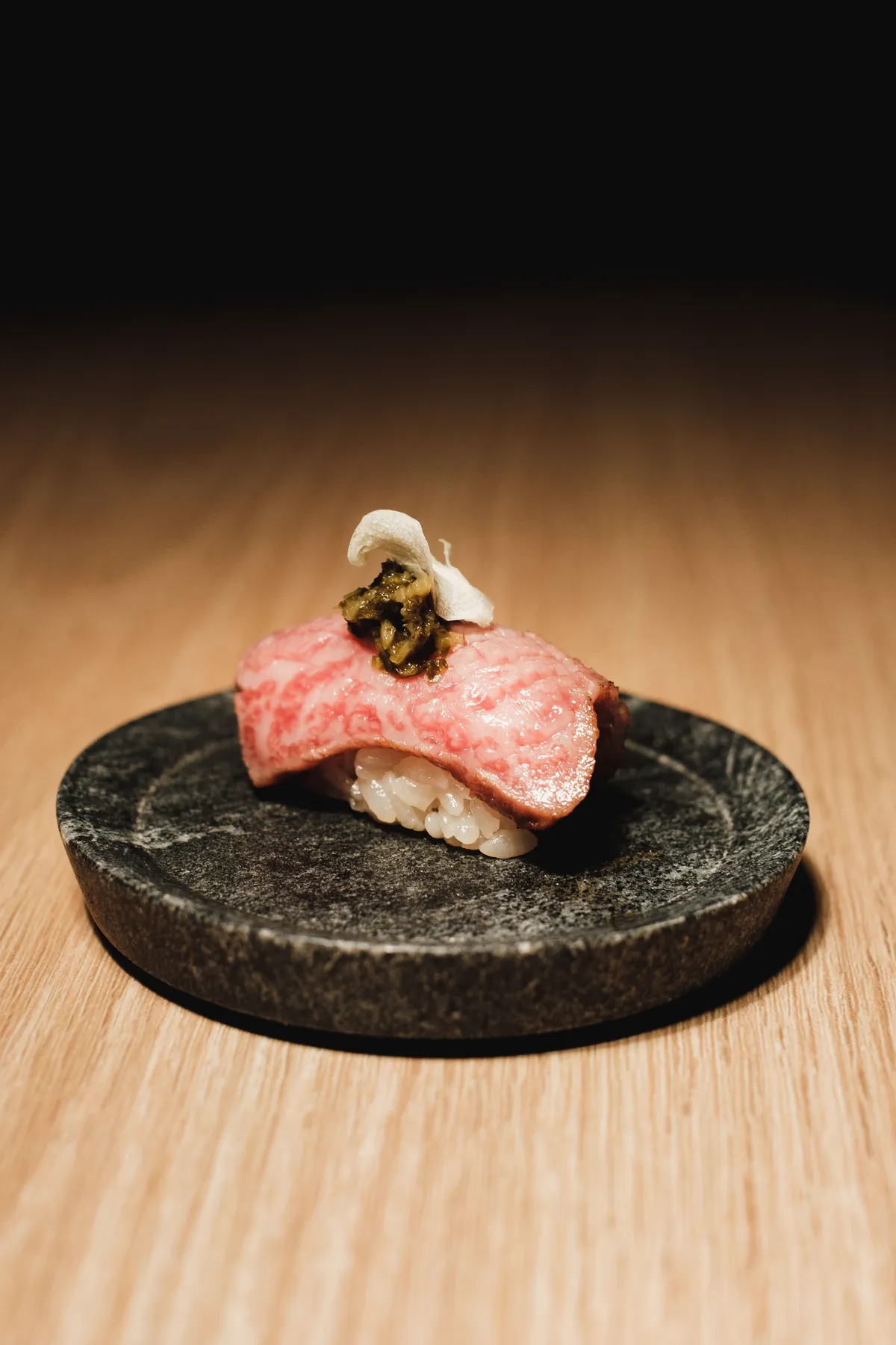 Wagyu nigiri on a stone plate