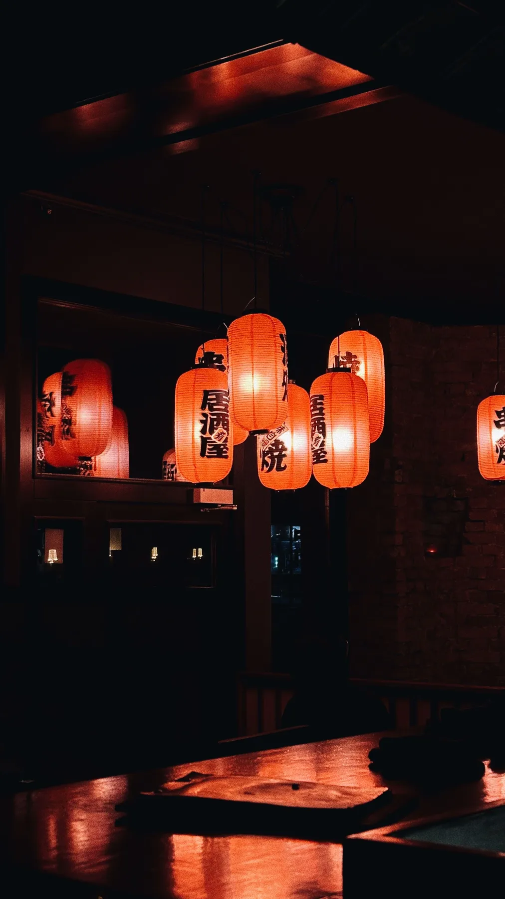 Paper lanterns in a dim room
